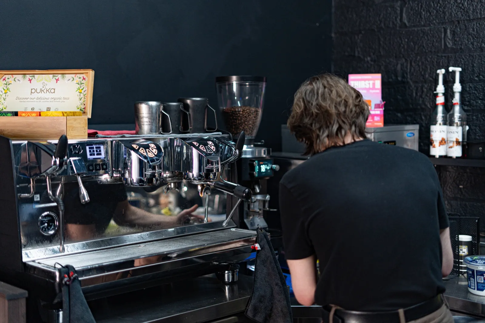 Barista at coffee station