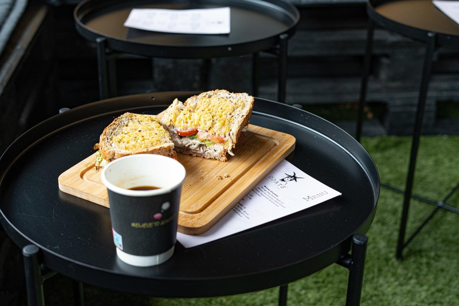 Sandwich at HQ Brew cafe table